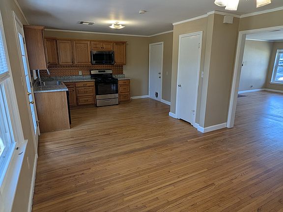 Dining room & kitchen with view of living room on right