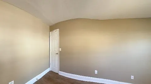 Primary bedroom with walk-in closet and ensuite bathroom with his/hers bathroom sinks