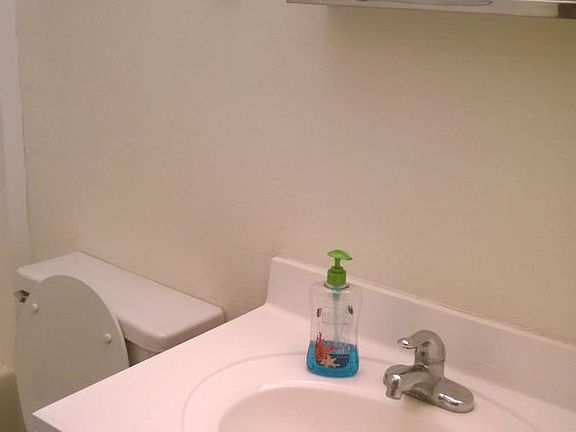 bathroom sink storage behind mirror