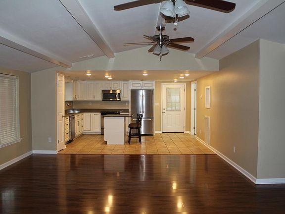 Custom cabinetry, lots of storage and built-ins, stainless appliances, opens to family room.