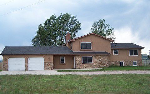 Stucco & stone home on 56 acres