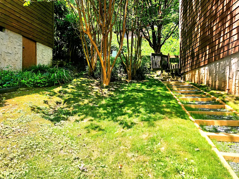 yard area between garage entrance and front door