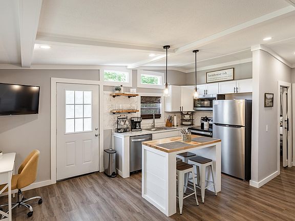 We have a spacious kitchen with brand new appliances, and a breakfast bar. Our outdoor patio is just off the kitchen.