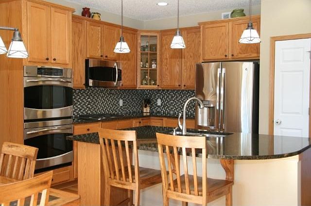 Awesome kitchen! There is a pantry ROOM and plenty of space to cook and eat with the family. Top of the line appliances, reverse osmosis system and maintenance free deck off the dining area.