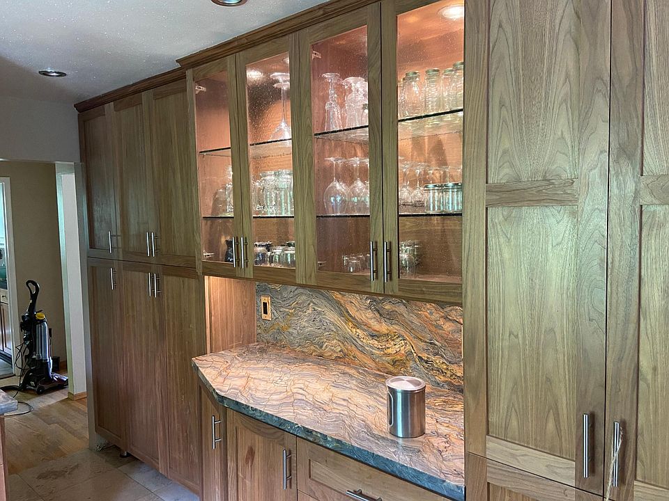 Under cabinet lighting, Brazilian granite countertops with walnut cabinets