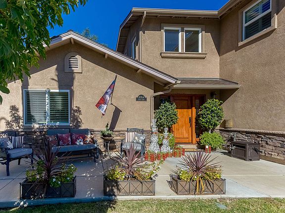 This renovated home offers a newer stucco exterior, newer Milgard windows, insulated garage door, stacked stone exterior wainescotting & much more!