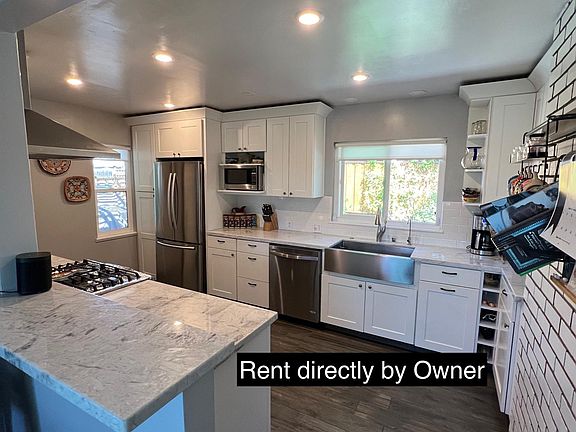 Kitchen view from the dining area: an application will be required - please do not send any money to unknown entities