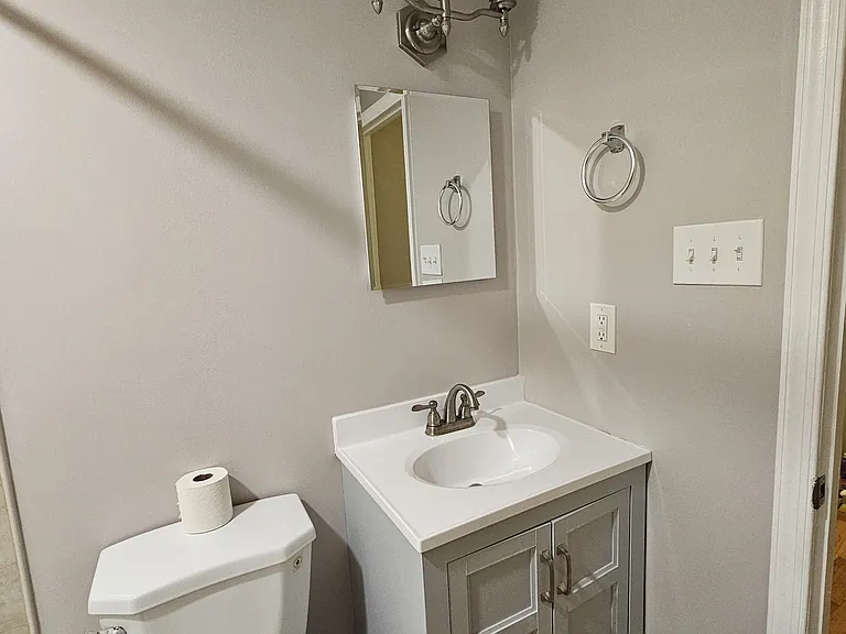 Bathroom vanity and toilet upper level, fully renovated!