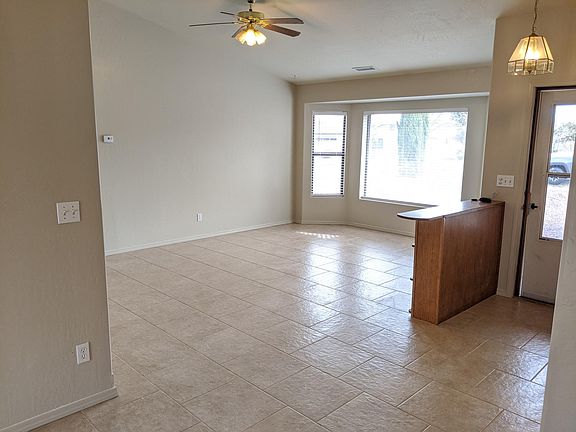 Living Room -- all new tile with built in book case, bay window and NEW blinds!