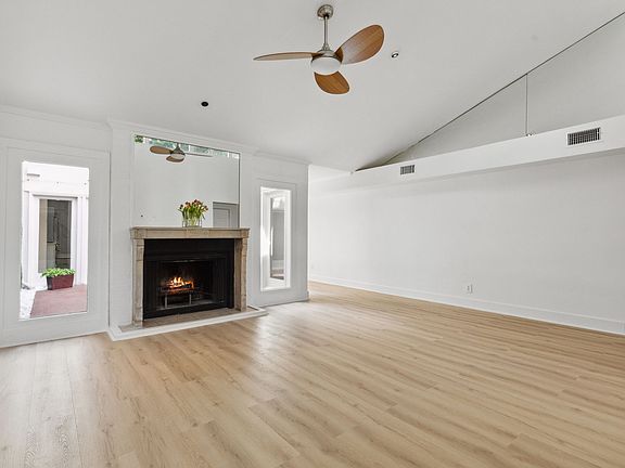 Living Room with Atrium View from Bar/Office Space