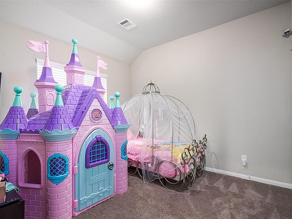 Extensive secondary bedroom with amazing double height ceilings.