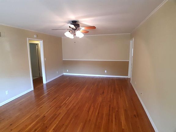 Living room with dining space viewed from front door entry