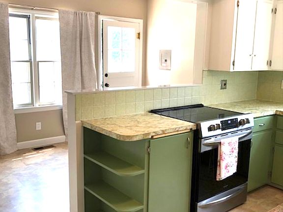Kitchen with breakfast nook and access to backyard & detached garage