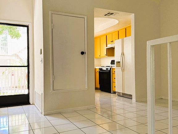 Entry way, kitchen and dining area to the right