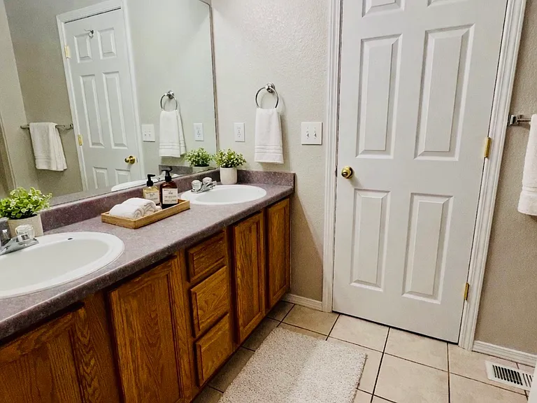 Upstairs Jack-and-Jill style bathroom vanity, virtually staged with decor only
