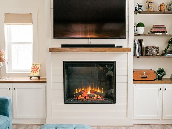 Living room with electric fireplace.