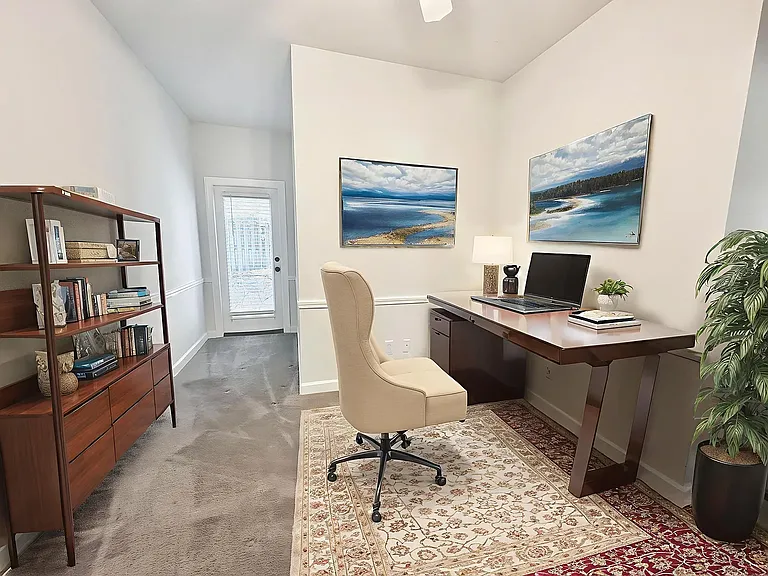 Bedroom 3 virtually staged as home office, door leads to back patio