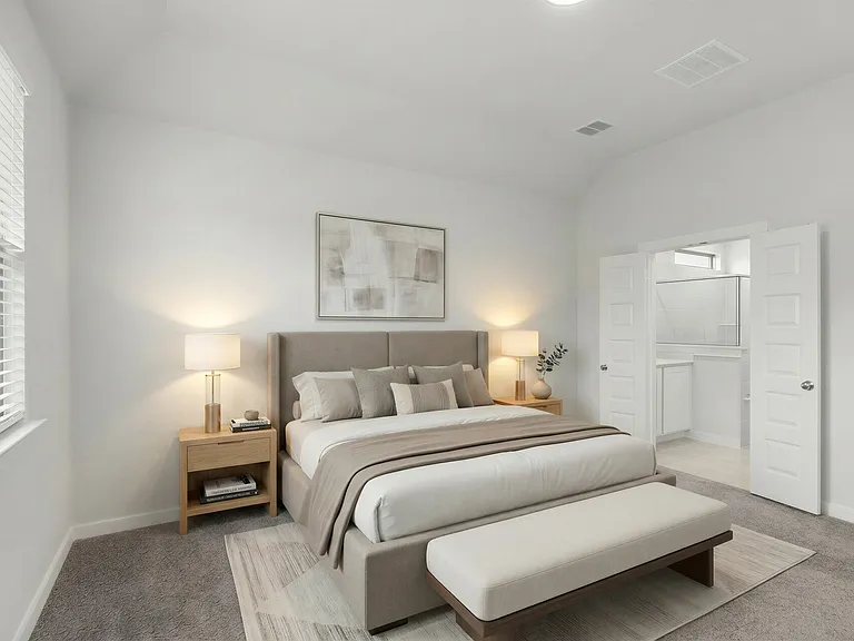 Virtually staged photo of the relaxing primary bedroom suite!
