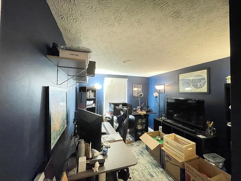 Previous residents' furniture; room repainted lighter color