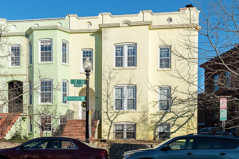 Corner Building is 520 2nd ST SE. Unit 1 (Terrace Level) windows are visible to the right of the steps.