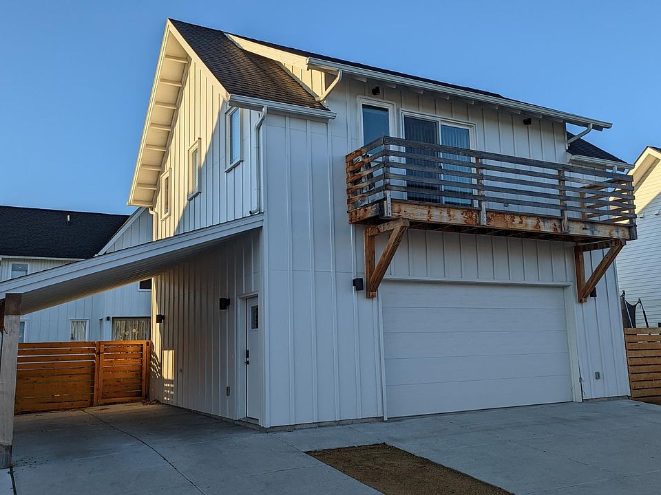 Covered carport area for parking with room for two cars.