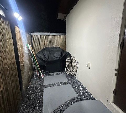 BBQ set outside the door at the end of the walk way