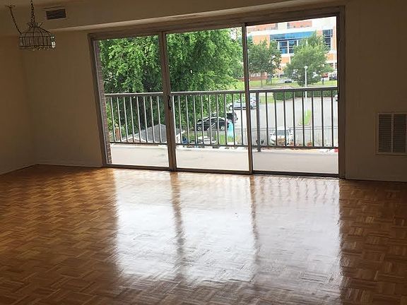 Spacious Living Room with Dining Area, and Large Balcony.