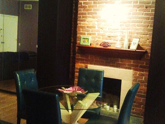 Exposed brick and wood mantles