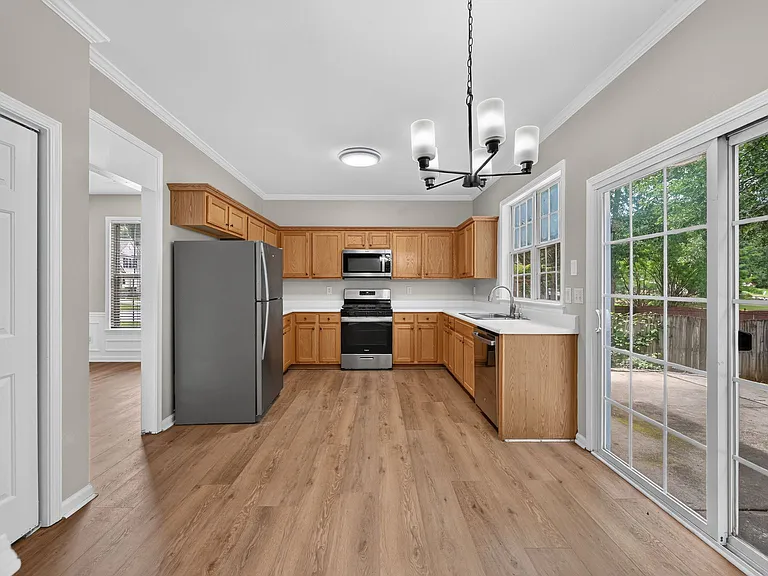 Bright open kitchen with SS appliances