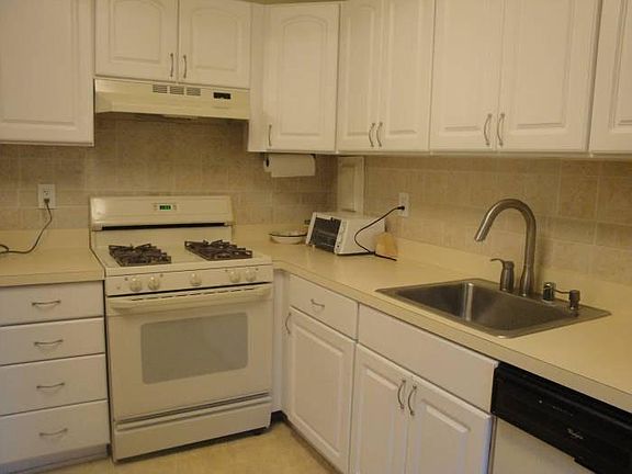 Updated kitchen with plenty of cabinet space.