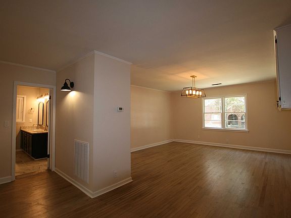 Picture from foyer - living, dining or multi-use room (R) and main bath (L).