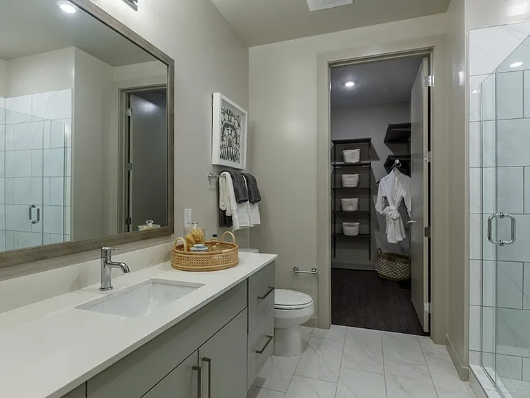 Bathroom with Glass Enclosed Shower and Custom Closet System (St. Arnold A Floorplan)
