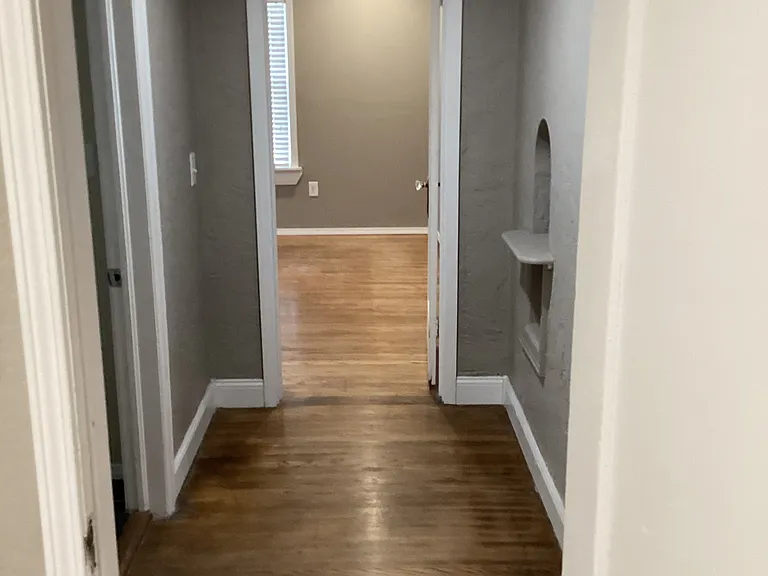 Looking West through hallway between SE and SW bedrooms.