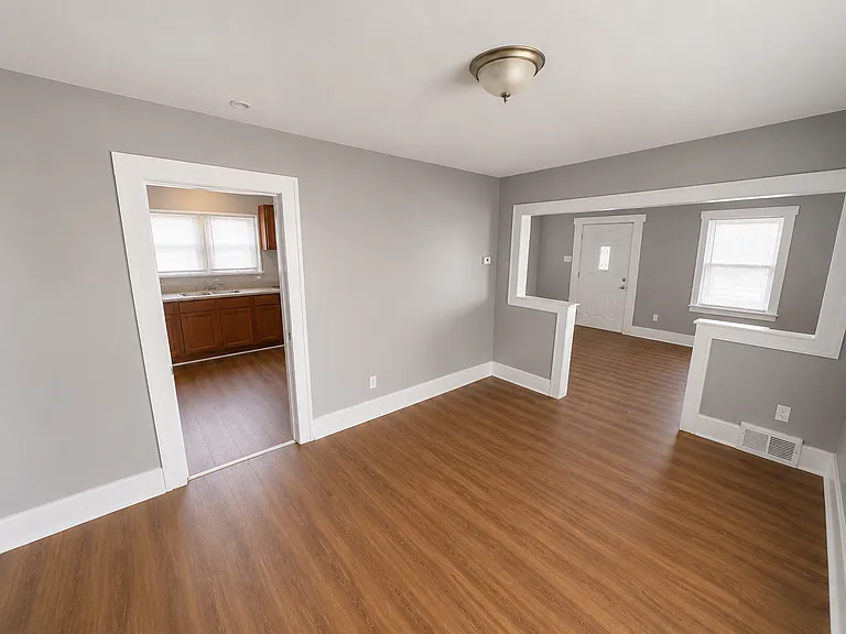 Dining or lounge room, looks into kitchen and front living room