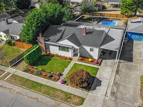 Carport will fit 2 vehicles in tandem + 2 in driveway + RV space on South side + street parking