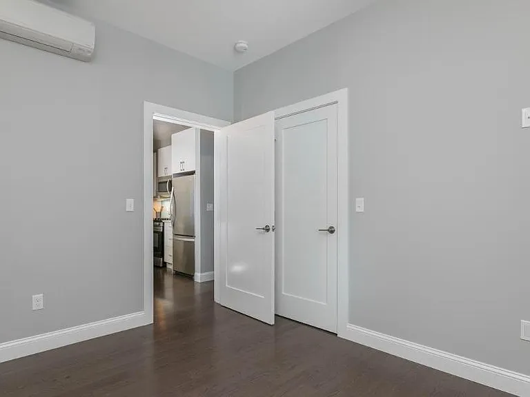 Bedroom #1. Fits a queen sized bed and dresser. Has custom California Closet design in closet.