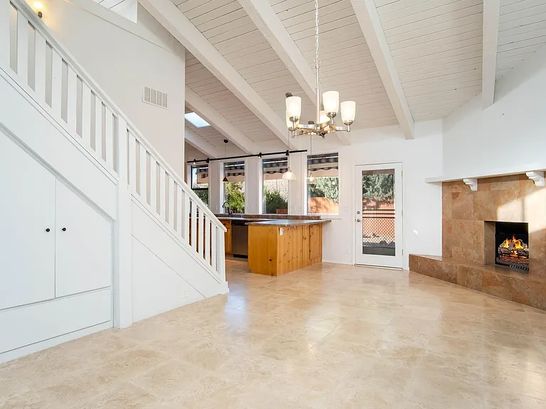 Dining area, gas fireplace and door to backyard