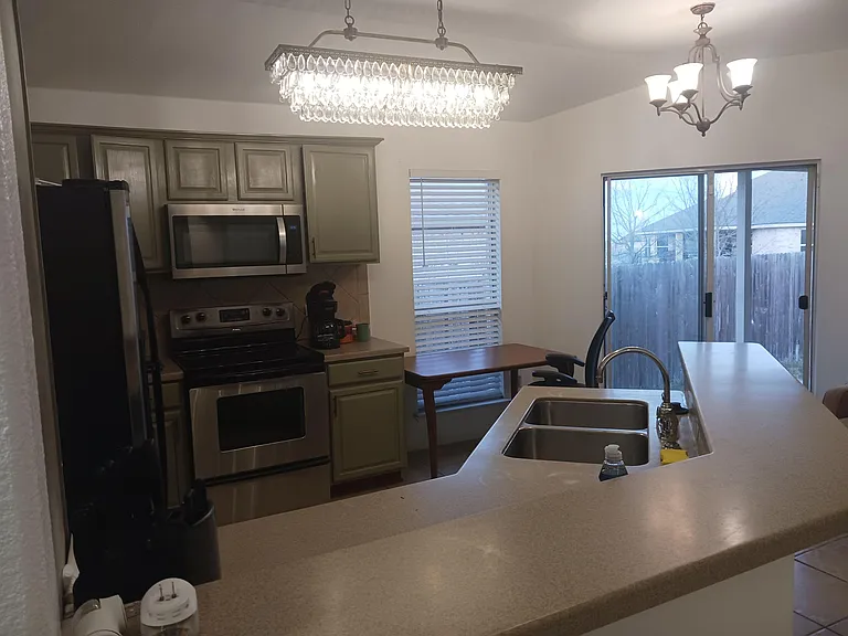 Dining room and door to covered patio for smoking outdoors.