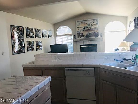 The Kitchen opens to the Family and Dining Rooms.