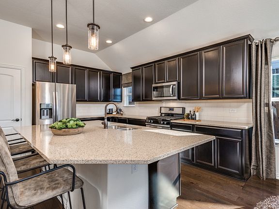 Abundant counter and cabinet space in this kitchen, perfect for meal prep or entertaining