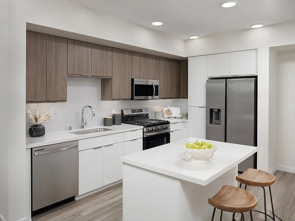 Two-tone cabinetry and quartz counters bring a clean, modern look.