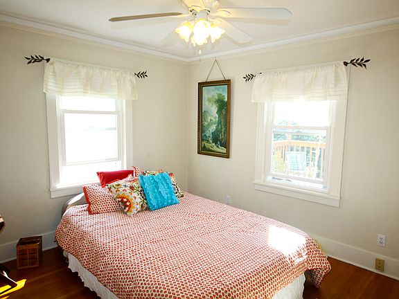 Master bed full of light.