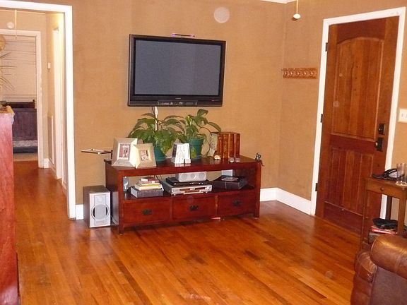 Living Room: Mahogony front door, original Red Oak finished floors