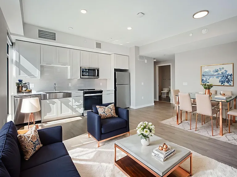 Relax in the living room, offering breathtaking views of the city skyline.