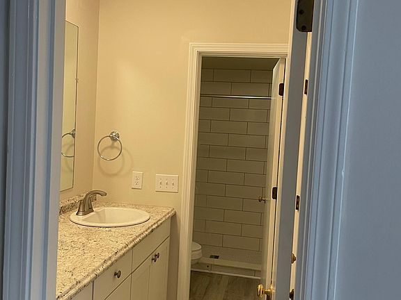 Bathroom with door from master bedroom. There is another door from hallway into bathroom