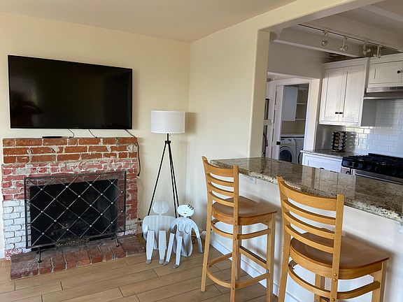 wood burning fireplace with kitchen counter