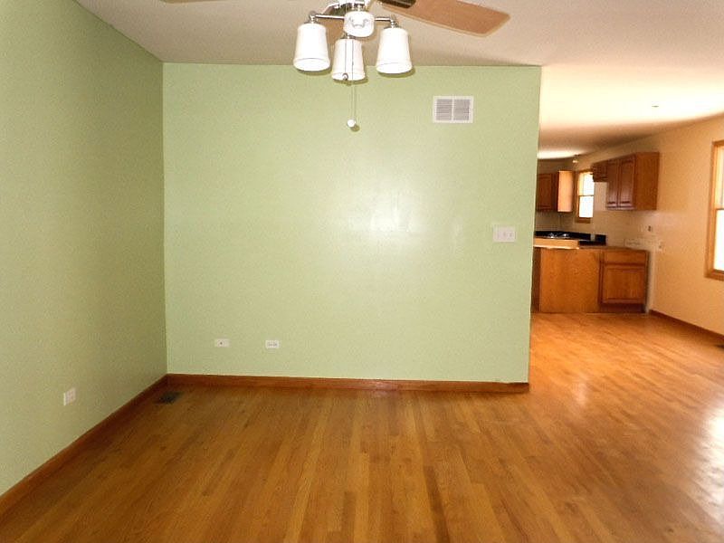 Spacious Main Level with Hardwood Flooring Adjacent to Kitchen 