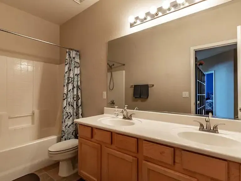 Bathroom #2 - upstairs. Dual sinks and bath/shower combo.