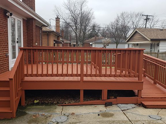 Backyard with wheelchair accessible ramp and huge deck