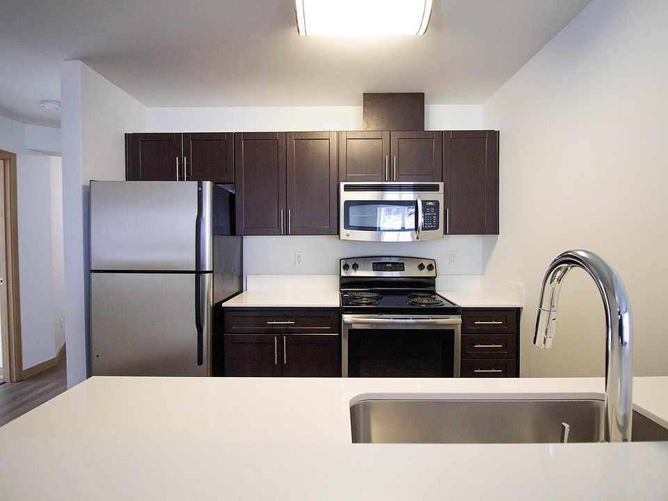 All new quartz countertops (select units), stainless steel appliances and modern fixtures.